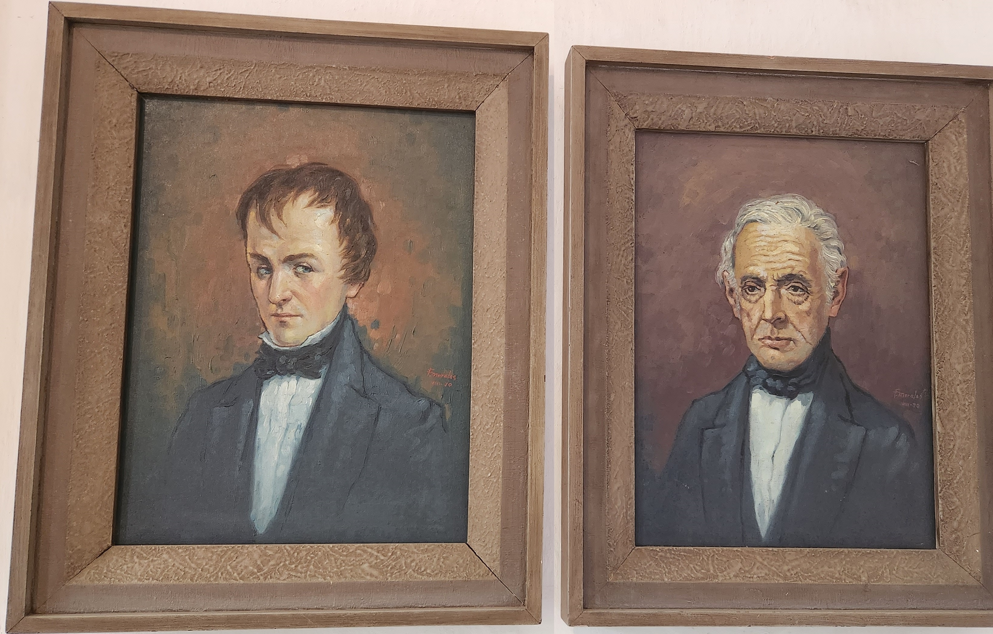 Orange typewriter on a wooden table close-up