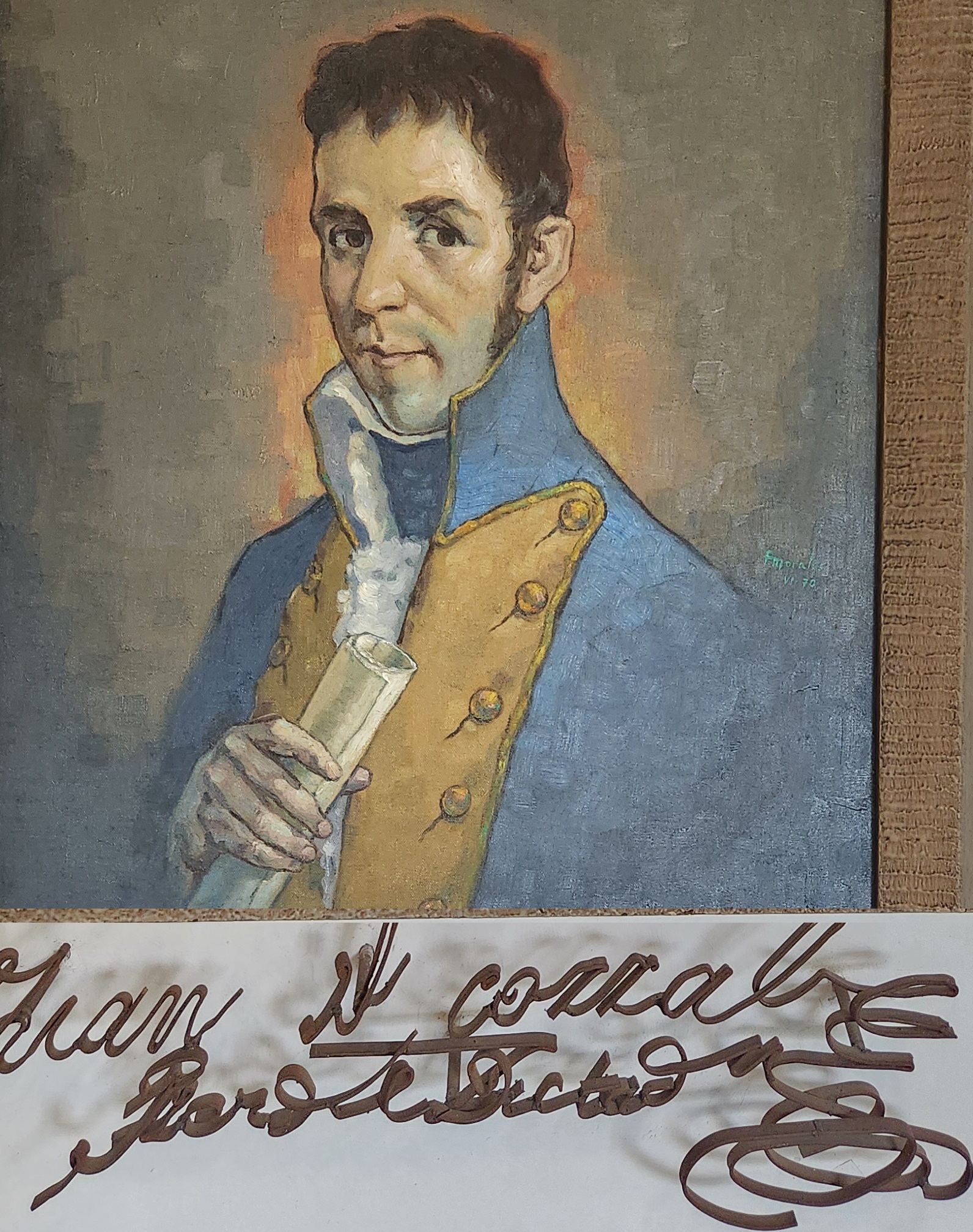 Orange typewriter on a wooden table close-up