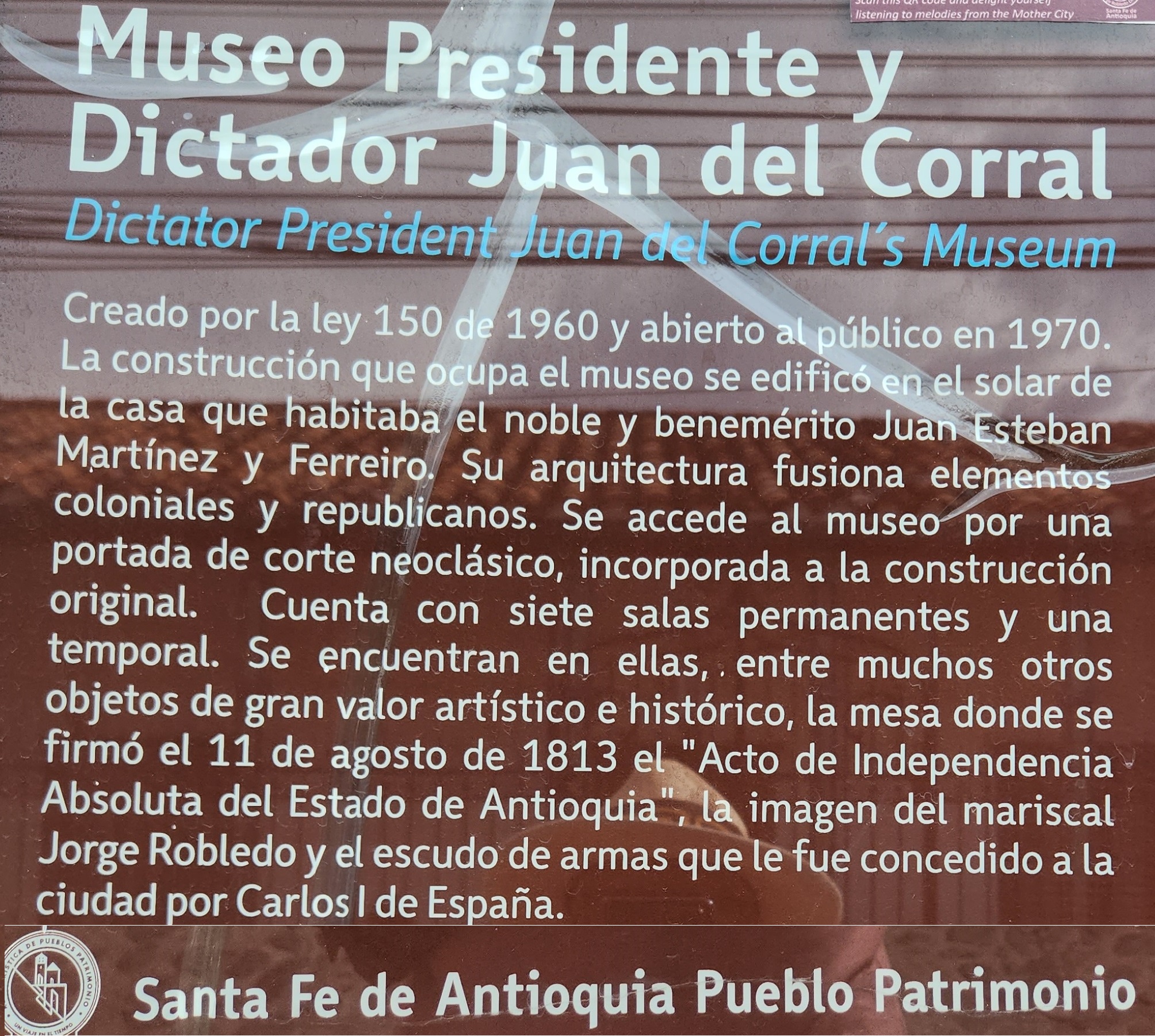 Orange typewriter on a wooden table close-up