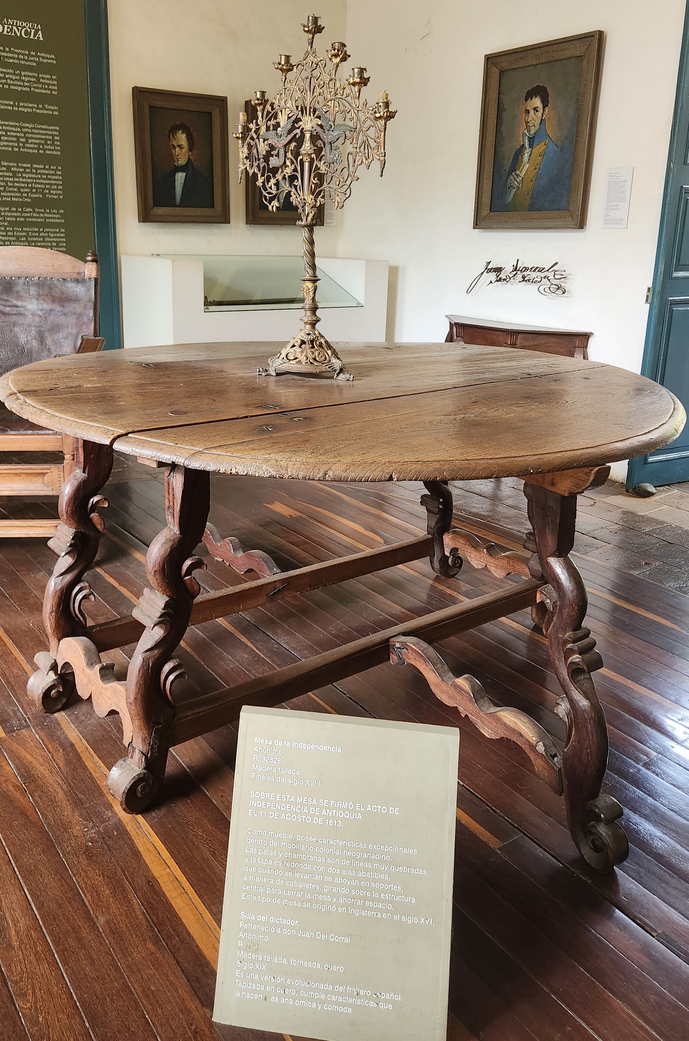 Orange typewriter on a wooden table close-up
